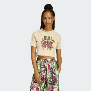 KOSZULKA ADIDAS x FARM RIO GRAPHIC T-SHIRT CROPPED. Białe bluzki ADIDAS, bez wzorów, casualowe, bez kołnierzyka, bez ramiączek. Za 149,00 zł.
