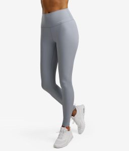 Legginsy sportowe damskie. Niebieskie legginsy NORDICDOTS, bez wzorów, z materiału. Za 365,00 zł.