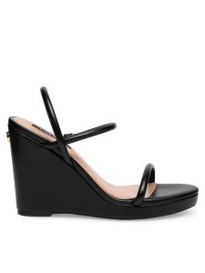 Nine West Sandały WFA2624-1 Czarny. Czarne sandały Nine West, bez wzorów, z syntetyku, bez obcasa, na koturnie, bez zapięcia. Za 131,99 zł.