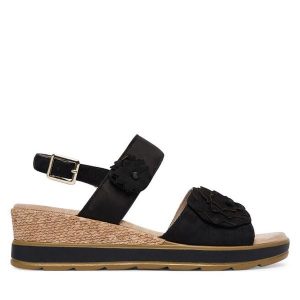 Sandały Caprice. Czarne sandały Caprice, bez wzorów, bez obcasa, na koturnie, bez zapięcia. Za 339,99 zł.