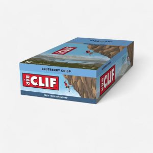 Baton energetyczny Clif Bar jagodowy 12 x 68 g. Fioletowe jeansy CLIF, bez wzorów. Za 99,99 zł.