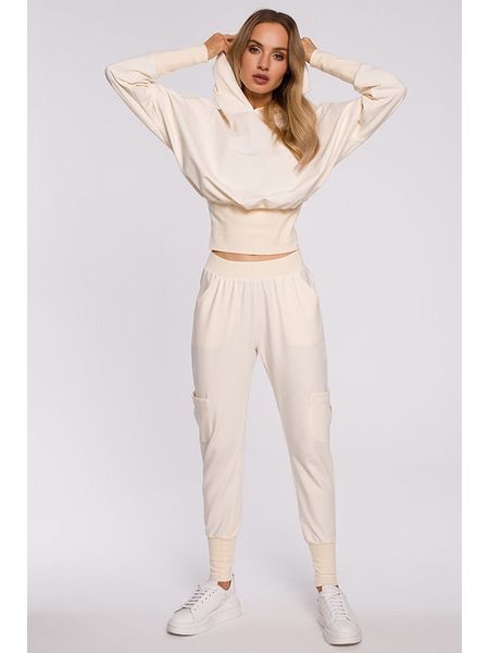 Made of emotion Spodnie dresowe w kolorze beżowo-kremowym rozmiar: S. Brązowe spodnie dresowe Made Of Emotion, s, bez wzorów, z dresówki. Za 87,19 zł.