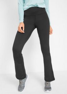 Spodnie sportowe z kieszenią i poszerzanymi nogawkami. Czarne legginsy bonprix, bez wzorów, na fitness i siłownię. Za 114,99 zł.