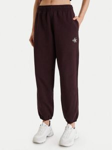 Calvin Klein Jeans Spodnie dresowe Monologo LV047B235G Brązowy Regular Fit. Brązowe spodnie dresowe Calvin Klein Jeans, m, bez wzorów, z bawełny. Za 309,99 zł.