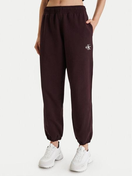 Calvin Klein Jeans Spodnie dresowe Monologo LV047B235G Brązowy Regular Fit. Brązowe spodnie dresowe Calvin Klein Jeans, m, bez wzorów, z bawełny. Za 379,99 zł.