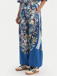 Adidas Spodnie dresowe Farm Rio Premium KD4643 Niebieski Loose Fit. Niebieskie spodnie dresowe ADIDAS, xs, bez wzorów, z dresówki. Za 499,99 zł.