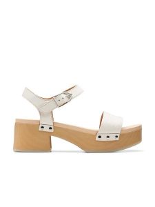 Clarks Skórzane sandały "Sivanne Bay" w kolorze kremowym na obcasie rozmiar: 39,5. Brązowe sandały Clarks, bez wzorów, z otwartym noskiem, bez obcasa, na koturnie, bez zapięcia. Za 180,06 zł.