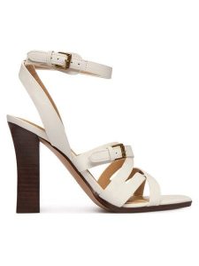 Guess Sandały FLJRAD LEA03 Kremowy. Białe sandały Guess, z aplikacjami, ze skóry, bez obcasa, na słupku, bez zapięcia. Za 580,99 zł.