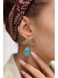 Pierres delicates Pozłacane kolczyki-wkrętki z turkusami i cyrkoniami rozmiar: onesize. Żółte kolczyki Pierres delicates, z cyrkonią, pozłacane. Za 109,26 zł.