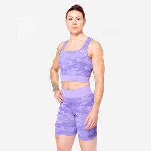 Koszulka fitness damska Domyos crop top. Fioletowe bluzki DOMYOS, xs, bez wzorów, z elastanu, sportowe, bez kołnierzyka, bez ramiączek. W wyprzedaży za 69,99 zł.