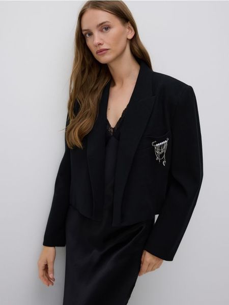 Marynarka z ozdobną aplikacją - czarny. Czarne marynarki i żakiety Reserved, l, z aplikacjami, z bawełny. W wyprzedaży za 109,99 zł.