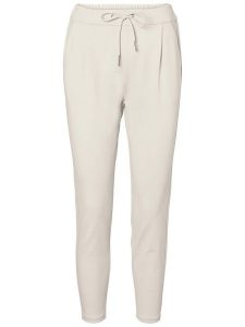 Vero Moda Spodnie "Eva" w kolorze kremowym rozmiar: M/L32. Brązowe rurki Vero Moda, z materiału. Za 100,99 zł.