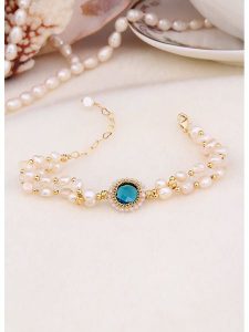 L'Atelier de Gaia Pozłacana bransoletka z perłami i cyrkoniami rozmiar: onesize. Białe bransoletki L'Atelier de Gaia, z cyrkonią, pozłacane. Za 60,99 zł.