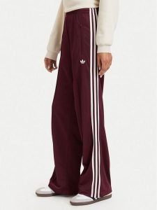 Adidas Spodnie dresowe Adicolor Classic Firebird KA7743 Brązowy Loose Fit. Brązowe spodnie dresowe ADIDAS, s, bez wzorów, z dresówki. Za 299,99 zł.