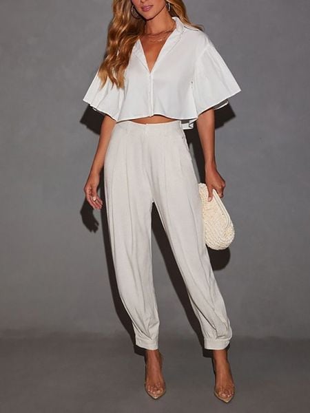 Milan Kiss Bluzka w kolorze białym rozmiar: S. Białe bluzki Milan Kiss, s, bez wzorów, z bawełny, bez kołnierzyka, bez ramiączek. Za 140,53 zł.