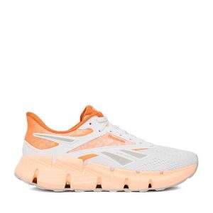 Buty do biegania Reebok. Białe buty sportowe Reebok, bez wzorów, bez zapięcia, do biegania. Za 369,99 zł.