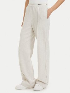 Calvin Klein Jeans Spodnie dresowe LV047G253G Kremowy Relaxed Fit. Białe spodnie dresowe Calvin Klein Jeans, xl, bez wzorów, z bawełny. Za 409,99 zł.