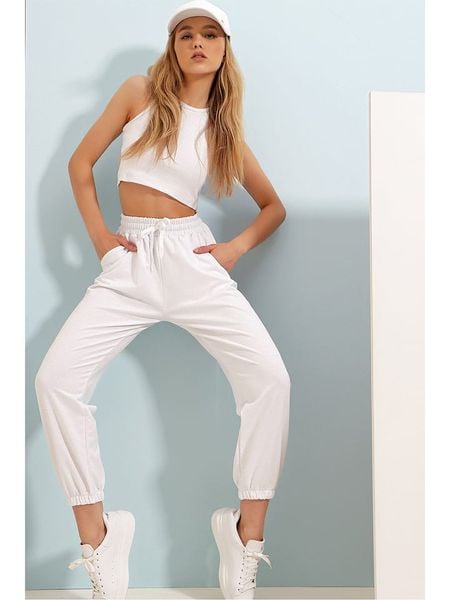 Happiness Istanbul Spodnie dresowe w kolorze kremowym rozmiar: L. Brązowe spodnie dresowe Happiness Istanbul, l, bez wzorów, z bawełny. Za 52,30 zł.