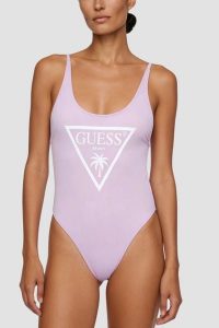 GUESS Lawendowy damski jednoczęściowy strój kąpielowy z logo Violet, Rozmiar S. Fioletowe stroje jednoczęściowe Guess, z aplikacjami. Za 389,99 zł.