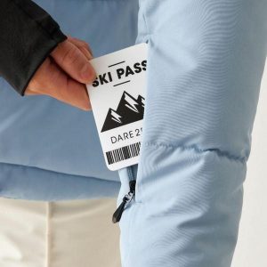 Damska kurtka z kapturem Dare 2B Glacier. Niebieskie kombinezony Dare 2b, bez wzorów, z puchu, eleganckie, bez kołnierzyka, bez ramiączek. Za 465,50 zł.