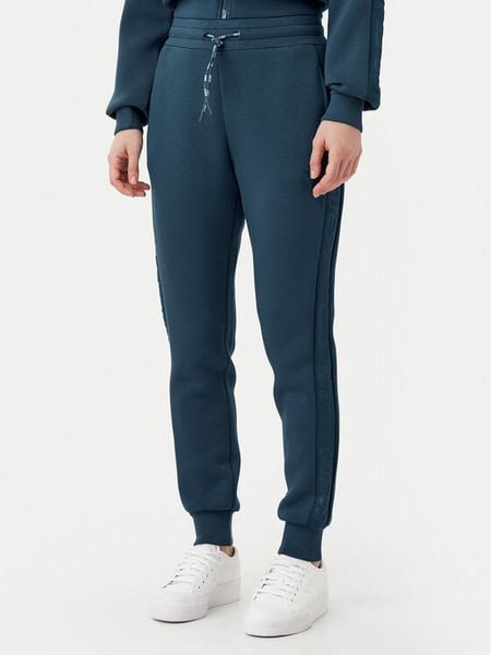 Guess Spodnie dresowe V2YB18 K7UW2 Niebieski Regular Fit. Niebieskie spodnie dresowe Guess, xxs, z aplikacjami, z dresówki. Za 189,99 zł.