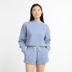 Bluza damska New Balance WT51514DUS – niebieska. Niebieskie bluzy New Balance, s, z aplikacjami, z bawełny, bez kaptura. Za 249,99 zł.
