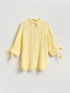 Muślinowa koszula - jasnożółty. Żółte koszule Reserved, l, bez wzorów, z bawełny, bez kołnierzyka, bez ramiączek. Za 109,99 zł.