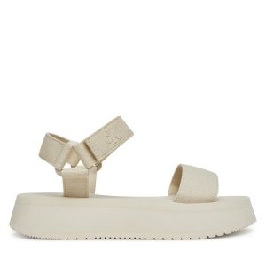 Sandały Calvin Klein Jeans. Sandały Calvin Klein Jeans, bez wzorów, z jeansu, bez obcasa, na koturnie, bez zapięcia. Za 229,99 zł.