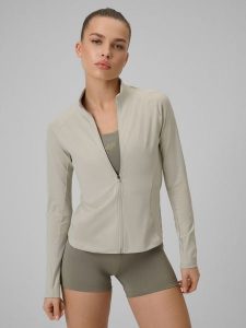 4F Bluza treningowa slim szybkoschnąca damska - beżowa M. Brązowe bluzy 4f, l, bez wzorów, bez kaptura. Za 179,99 zł.