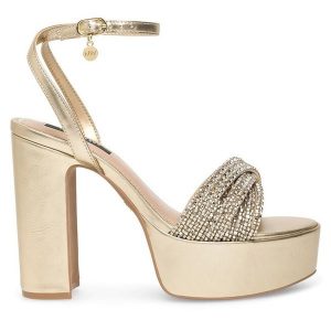 Sandały Nine West. Żółte sandały Nine West, bez wzorów, bez obcasa, na słupku, bez zapięcia. Za 155,99 zł.