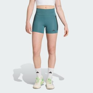 Legginsy Optime 3-Stripes 1/4 Short. Niebieskie legginsy ADIDAS, bez wzorów, z materiału, krótkie. Za 199,00 zł.