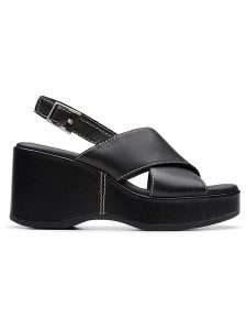 Clarks Skórzane sandały "Manon Wish" w kolorze czarnym na koturnie rozmiar: 37. Czarne sandały Clarks, bez wzorów, z otwartym noskiem, bez obcasa, na koturnie, bez zapięcia. Za 223,99 zł.