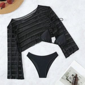 Komplet plażowy z ażurową narzutką i bikini na lato Tressa. Czarne bikini Intica, w ażurowe wzory. W wyprzedaży za 169,00 zł.