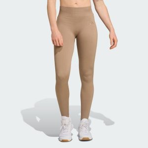 Długie dzianinowe legginsy do ćwiczeń Essentials. Zielone legginsy ADIDAS, bez wzorów, z dzianiny, długie. Za 217,30 zł.