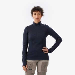 Koszulka damska trekkingowa z długim rękawem Merino Resist. Czarne bluzki FORCLAZ, m, bez wzorów, z materiału, sportowe, bez kołnierzyka, bez ramiączek. Za 299,99 zł.