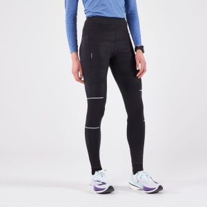 Legginsy do biegania damskie Kiprun Warm Rain ocieplane. Czarne legginsy KIPRUN, bez wzorów, z elastanu. Za 189,99 zł.