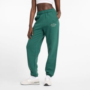 Spodnie damskie New Balance WP43500NWG – zielone. Zielone spodnie z wysokim stanem New Balance, z aplikacjami, z bawełny, z podwyższonym stanem. Za 299,99 zł.