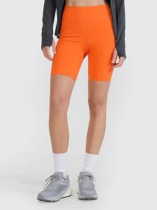 4F Szorty funkcyjne w kolorze pomarańczowym rozmiar: L. Pomarańczowe spodenki sportowe 4f, l, bez wzorów, z materiału, na fitness i siłownię. Za 94,95 zł.