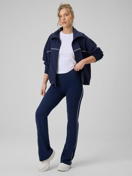 4F Legginsy z rozszerzanymi nogawkami damskie - granatowe XL. Niebieskie legginsy 4f, bez wzorów, z bawełny, z podwyższonym stanem. Za 129,99 zł.