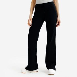 Rozszerzane legginsy damskie Elementals. Czarne legginsy DECATHLON, bez wzorów, z bawełny. Za 89,99 zł.