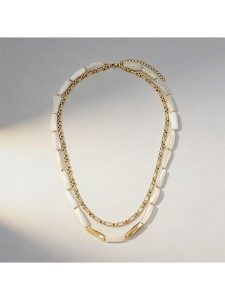 Nomad Pozłacany naszyjnik z elementami ozdobnymi - dł. 44,5 cm rozmiar: onesize. Białe naszyjniki Nomad, z perłą, pozłacane. Za 159,95 zł.