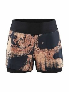 Craft Szorty kolarskie 2in1 "ADV Essence" w kolorze pomarańczowo-czarnym rozmiar: L. Czarne spodenki sportowe Craft, l, bez wzorów, z materiału, rowerowe. Za 85,95 zł.