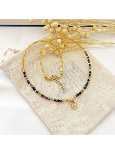 Atelier MIU Pozłacany naszyjnik z elementem ozdobnym - dł. 38 cm rozmiar: onesize. Czarne naszyjniki Atelier MIU, z perłą, pozłacane. Za 30,99 zł.