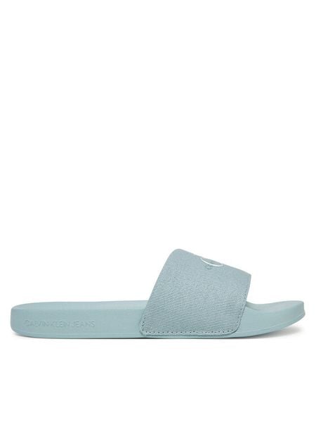 Calvin Klein Jeans Klapki Slide Monogram Wn YW0YW01835 Niebieski. Niebieskie klapki Calvin Klein Jeans, bez wzorów, z jeansu, bez obcasa. Za 99,99 zł.