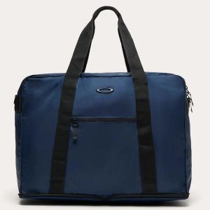 Torba podróżna Oakley PACKABLE 42 L FOS901958-6GA. Niebieskie torby podróżne i sportowe Oakley, z aplikacjami, z materiału, na ramię. Za 272,39 zł.