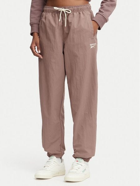 Reebok Spodnie dresowe Kalina RK25694CCW - LIGHT COCOA/LINEN Brązowy Relaxed Fit. Brązowe spodnie dresowe Reebok, xs, bez wzorów, z dresówki. Za 259,99 zł.