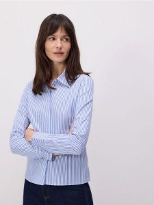 Bawełniana koszula - niebieski. Niebieskie koszule Reserved, l, bez wzorów, z bawełny, bez kołnierzyka, bez ramiączek. W wyprzedaży za 59,99 zł.