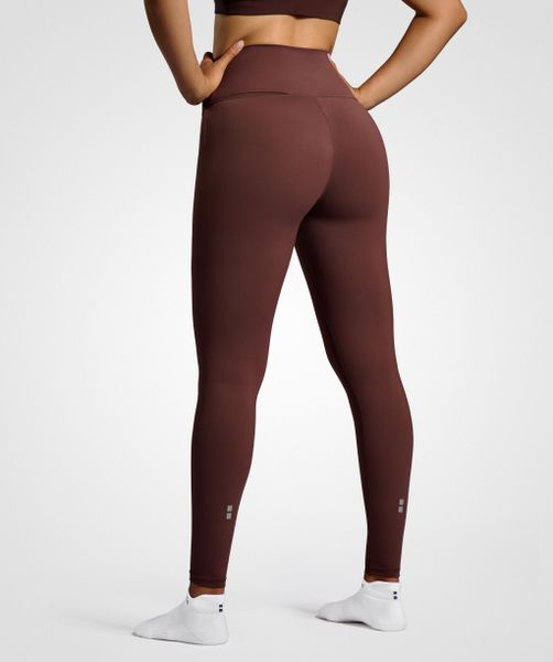 Legginsy do tenisa/padel damskie Smart z kieszenią na piłki. Brązowe legginsy NORDICDOTS, bez wzorów, z bawełny. Za 182,50 zł.