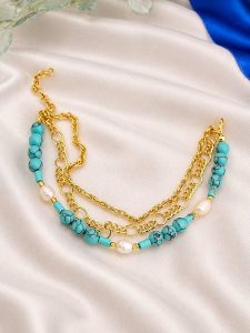 L'Atelier de Gaia Pozłacana bransoletka z perłami na kostkę rozmiar: onesize. Białe bransoletki L'Atelier de Gaia, z perłą, pozłacane. Za 38,95 zł.