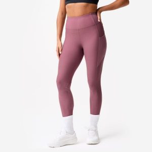 Legginsy fitness damskie Domyos. Fioletowe legginsy DOMYOS, bez wzorów, z elastanu, z podwyższonym stanem. Za 79,99 zł.